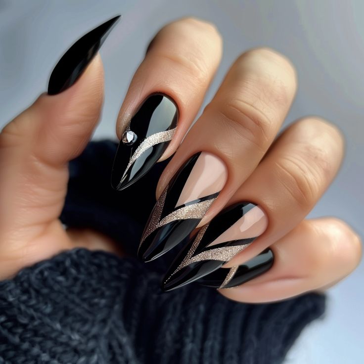 Striking Elegant Black Stiletto Nails with Shimmering Silver Accents and Geometric Patterns