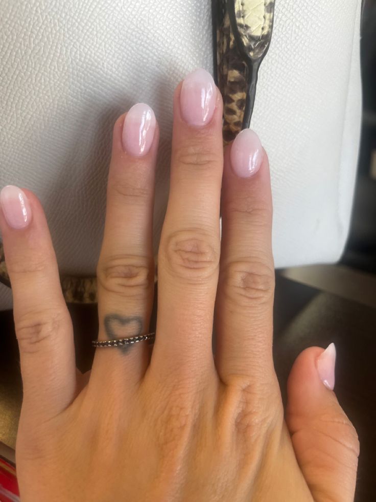 Sleek and Subtle Soft Pink Oval Nail Design for Any Occasion.