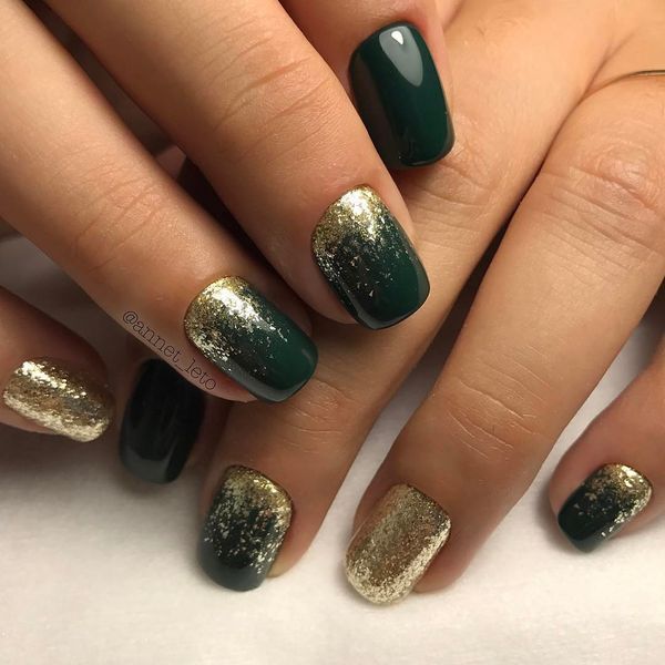 Glamorous Deep Green and Gold Accent Nail Design.