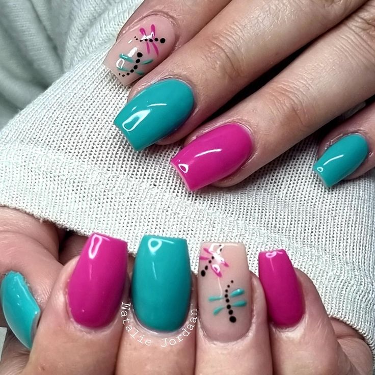 Vibrant Turquoise and Pink Nail Art with Floral Accents and Dot Patterns for a Cheerful Look.