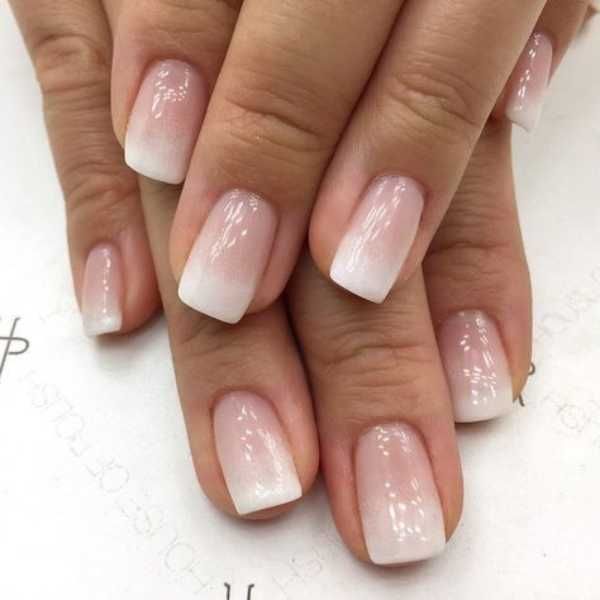 Sophisticated Ombre Nails: Sheer Pink to Crisp White for Versatile Elegance.