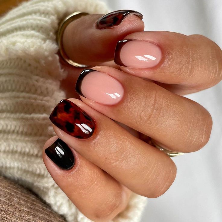 Stylish Nail Design: Glossy Nude and Deep Black with Tortoiseshell Accents