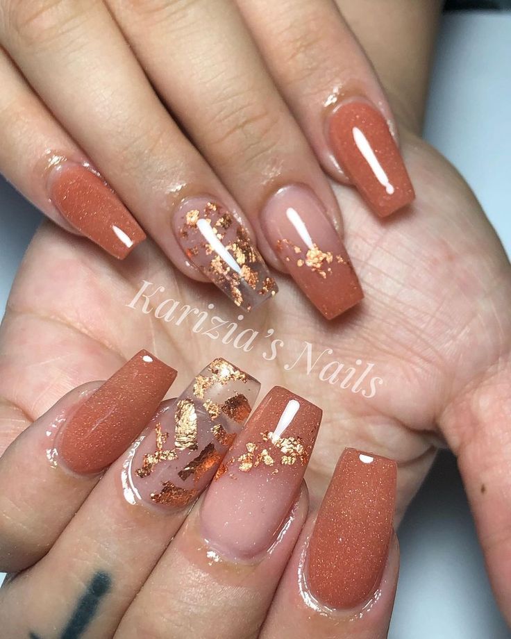 Chic Terracotta Nail Design with Gold Leaf Accents and Textured Finishes.