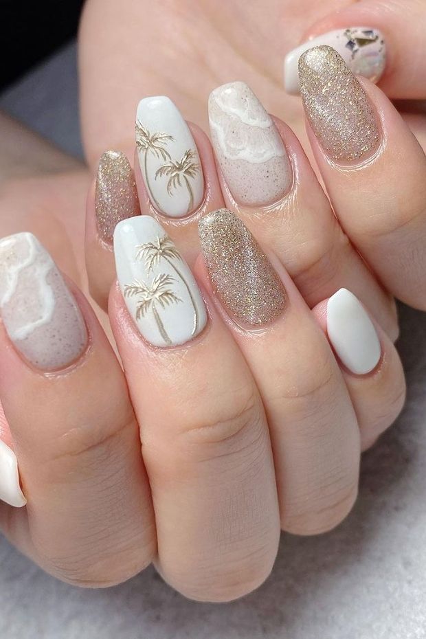 Beachy Nail Design with Palm Tree Accents and Shimmering Gold Glamour.