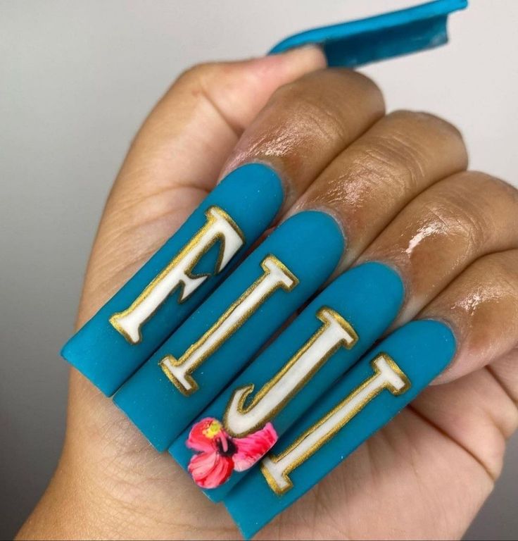 Chic Summer Manicure: Vibrant Turquoise with Gold Lettering and Floral Accents.