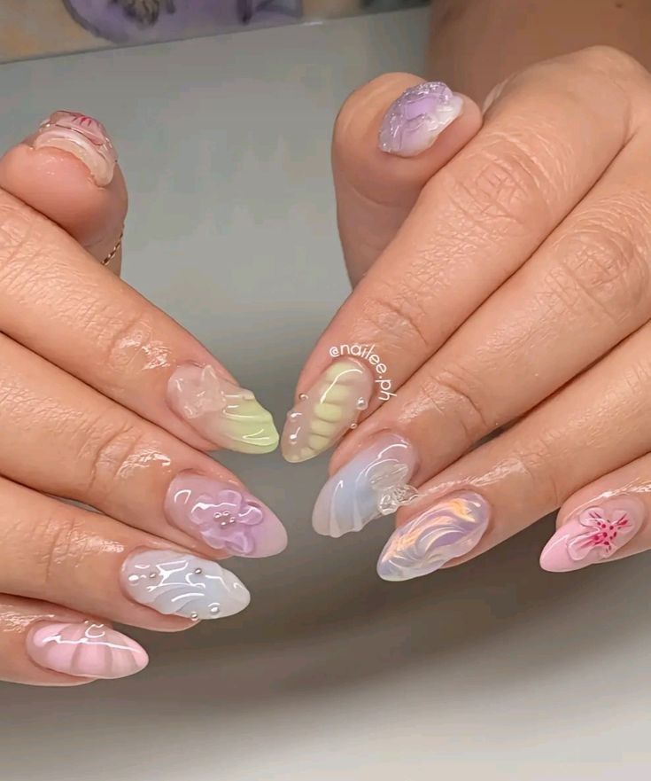 Vibrant Nail Art: Intricate Designs and Playful Aesthetics in Pastel Gloss Finishes.