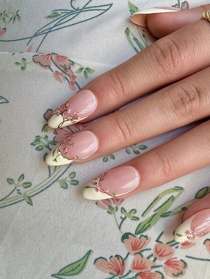 Delicate Pink Floral Nail Design with Soft White Tips, Perfect for Spring and Special Occasions.