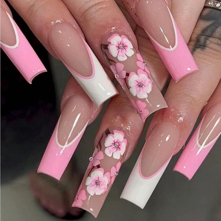 Delicate Floral Nail Design with Pink Hues and Elegant French Tips.