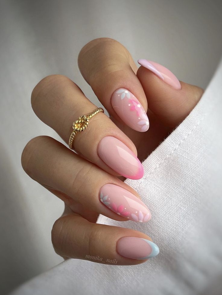 Charming Spring-Inspired Pastel Nail Design with Floral Accents and Gradient Tips.