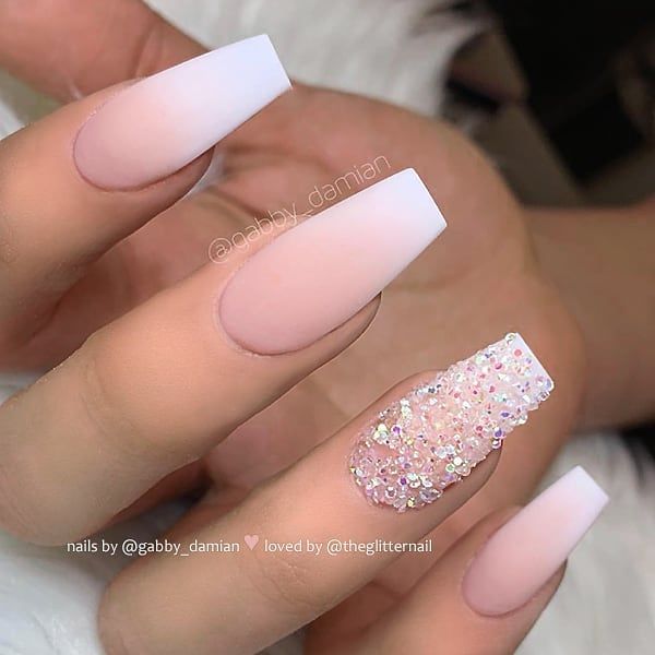 Elegant Ombre Nail Design: Soft Pink to Glossy White with Holographic Glitter Accent.