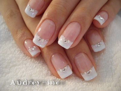 Sophisticated French Manicure with Rhinestones: A Timeless Blend of Elegance and Sparkle.