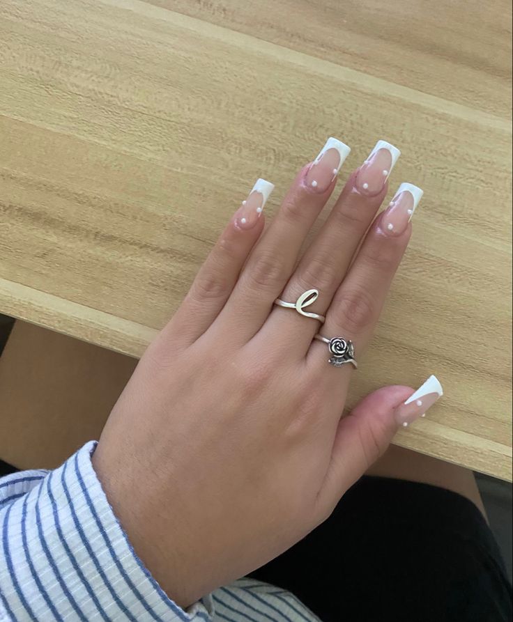 Chic Long French Tip Nails with Soft Pink Base and Delicate White Dot Accents.