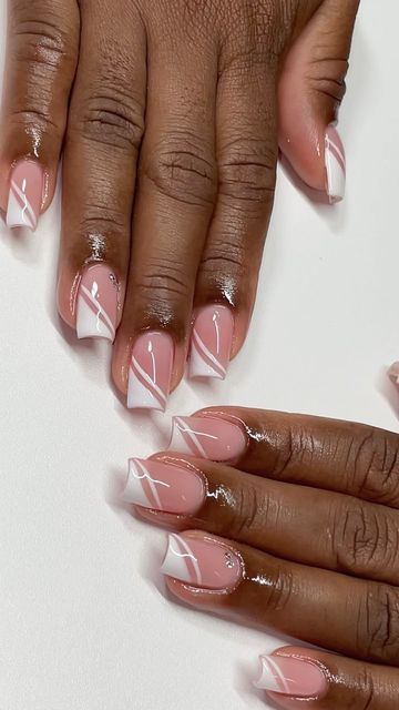 Chic Soft Pink Nail Design with Crisp White Tips and Artistic Lines