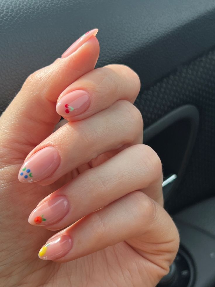 Charming Delicate Floral Nail Design with Soft Pink Base and Vibrant Accents.