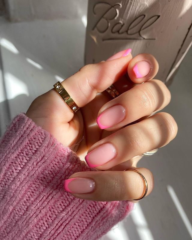 Playful Pink Nail Design: Subtle Base and Vibrant Tips for Any Occasion