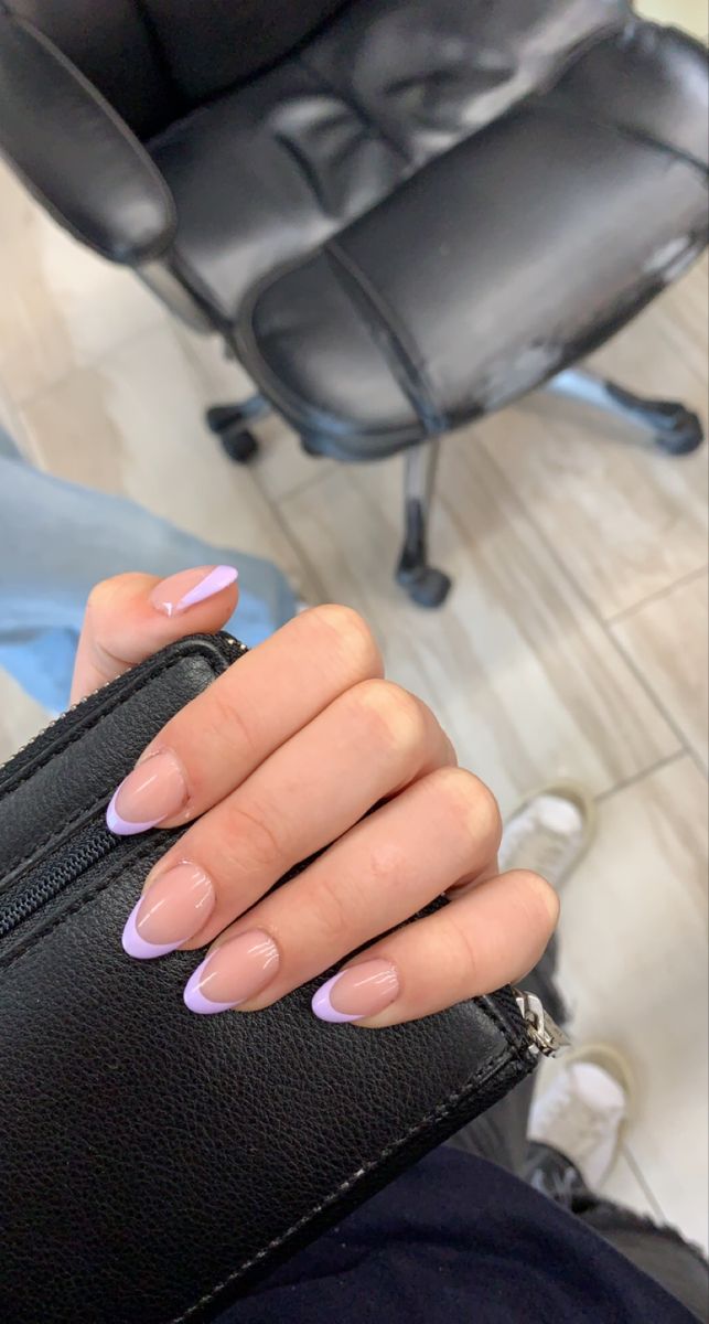 Chic Almond-Shaped Nude Nails with Delicate Lavender Tips for a Sophisticated Look.