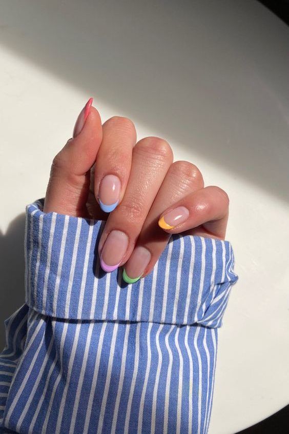 Playful Minimalist French Tip Nails with Pastel Accents.