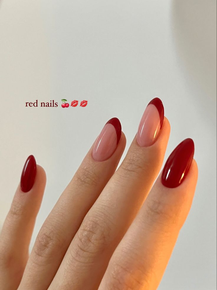 Chic Red Nail Design: Elegant Almond Tips with Nude Base.