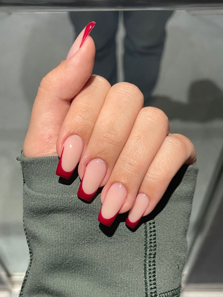 Chic Nude and Bold Red Gradient Nail Design: Elegance Meets Flair.