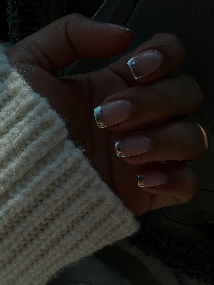 Chic Soft Pink and Metallic French Manicure Paired with Cozy Sweater Aesthetic.