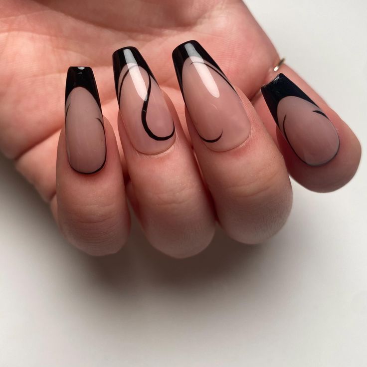 Chic Nude and Black Nail Design with Artistic Swirls