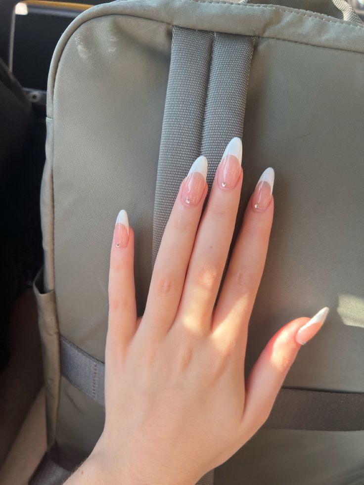 Timeless Almond-Shaped French Manicure with Delicate Gradient and Rhinestone Embellishments