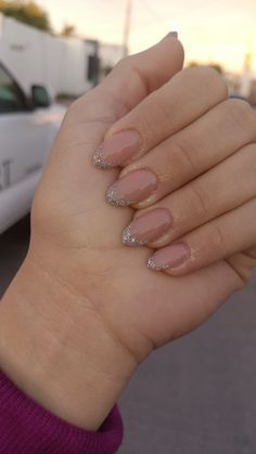 Chic Sophistication: Subtle Nude Nail Design with Sparkling Silver Tips.