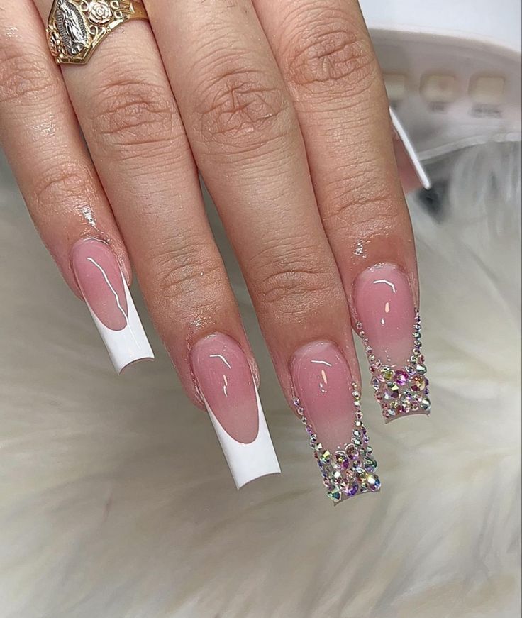 Sophisticated Nude Nail Design with Glamorous White Tips and Rhinestones.