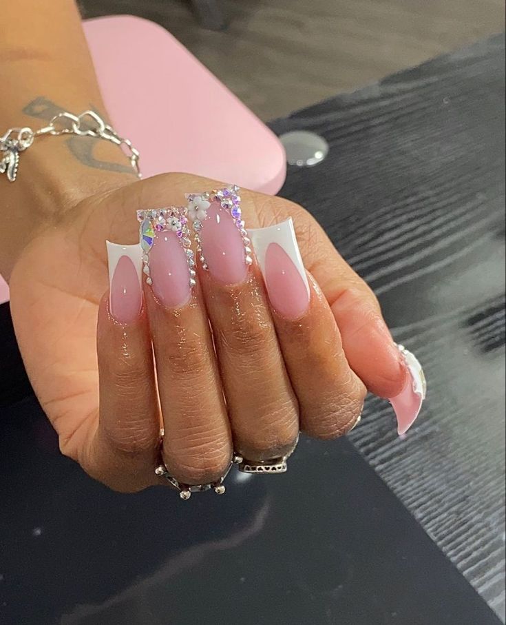 Sophisticated Soft Pink and White Nail Design with Glamorous Rhinestone Accents.