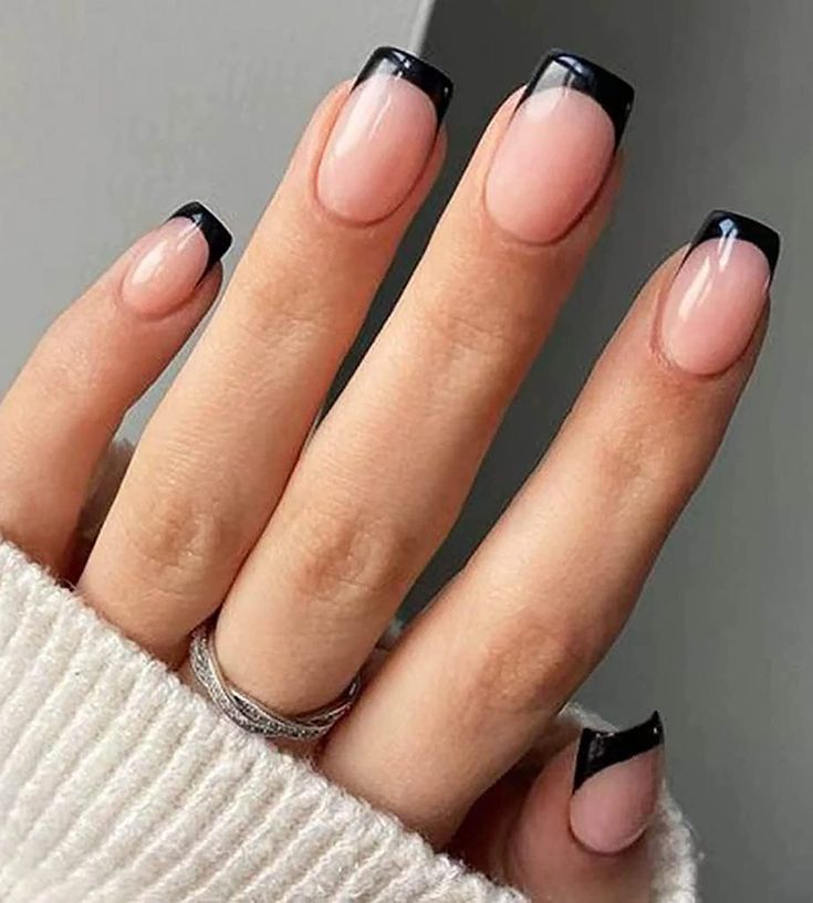 Chic Nude and Black Tip Nail Design: A Sophisticated Modern Twist on French Manicure.