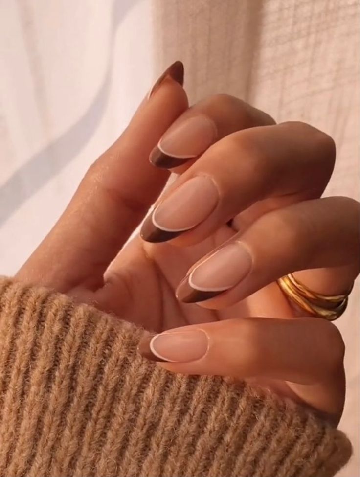 Chic Nude and Brown French Manicure with Gold Accents.