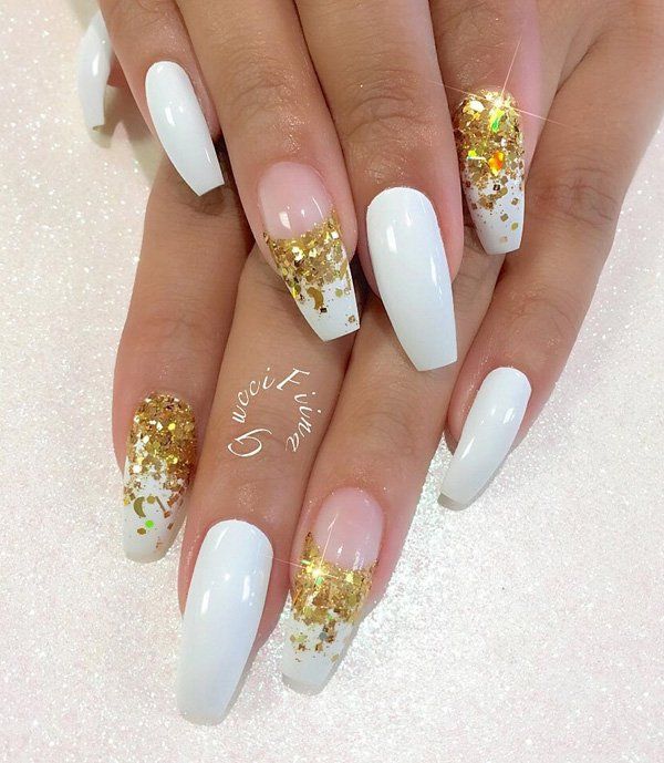 Glamorous Gradient Nail Design: Glossy White with Sparkling Gold Glitter Tips