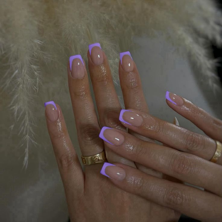 Sophisticated Nude Nails with Soft Lavender Tips and Glossy Finish.