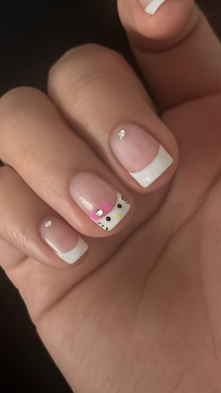 Whimsical French Tip Nail Design with Colorful Character Accents