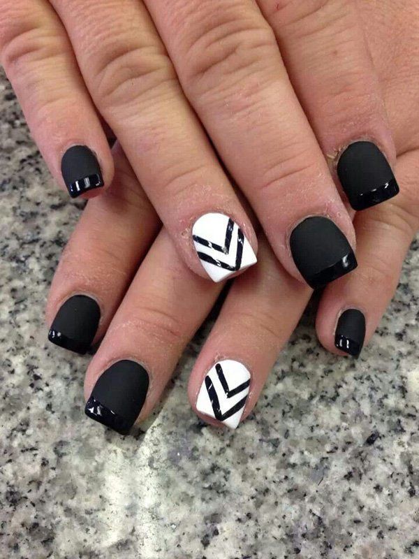 Chic Matte Black and Glossy Tip Nail Design with Bold Chevron Accent