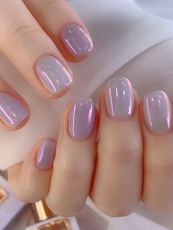 Sophisticated Pastel Gradient Nail Design with Glossy Finish and Shimmer Accents