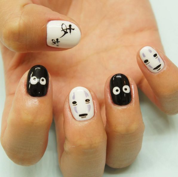 Whimsical Character Designs in Playful Black and White Nail Art