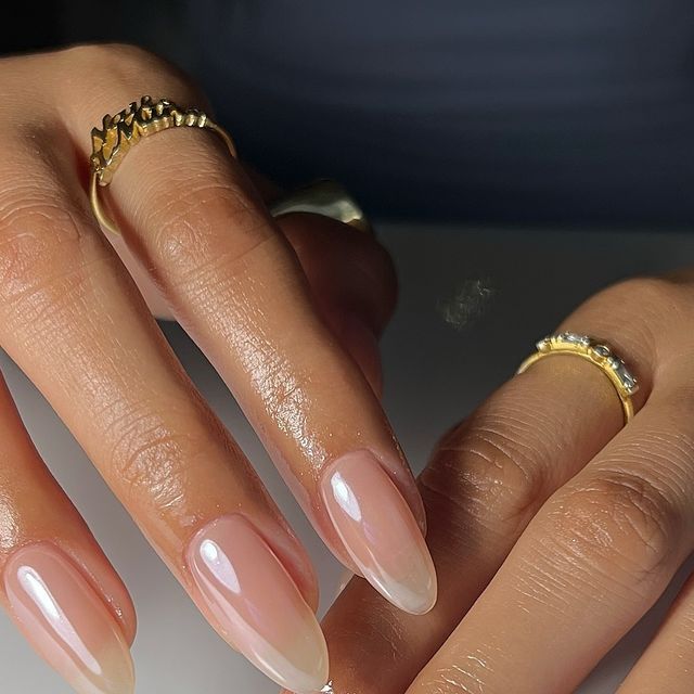 Chic Almond-Shaped Nails with Subtle Gradient and Gold Accents for Understated Elegance.