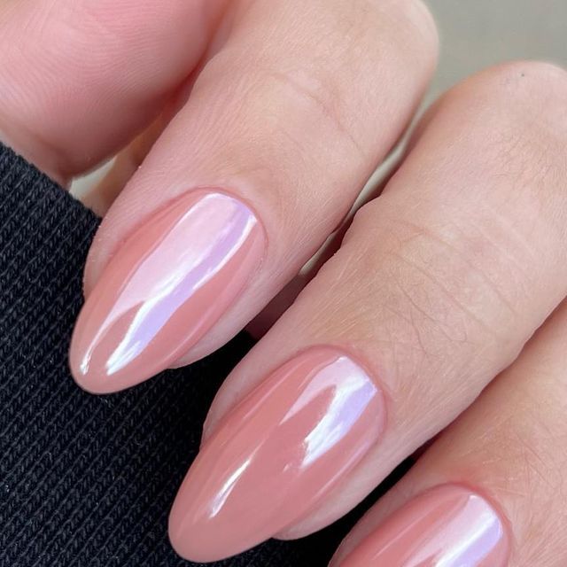 Sophisticated Soft Pink Nail Polish Design with Glossy Finish on Almond Nails.