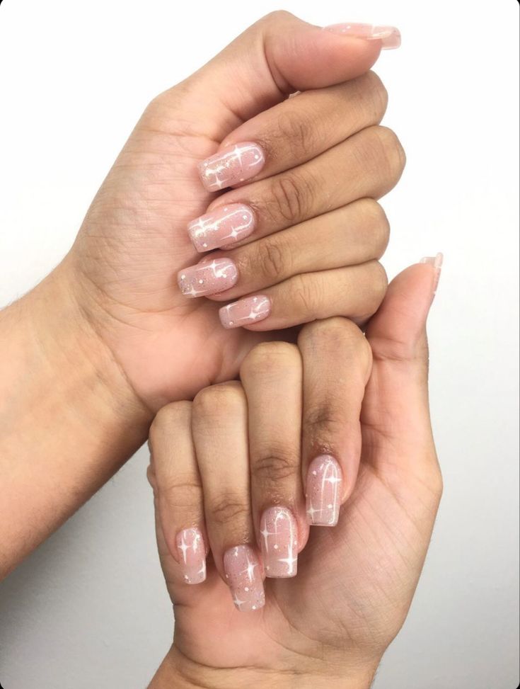 Chic Minimalist Nail Design: Soft Nude Base with Delicate White Line Art.