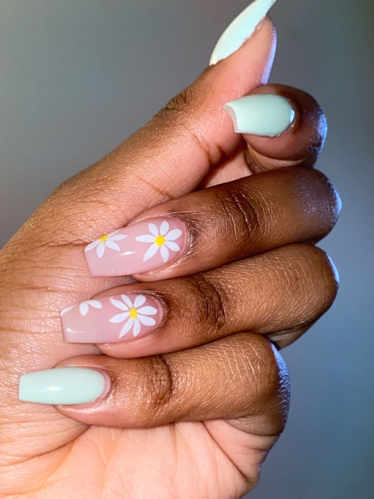 Charming Floral Nail Design: Soft Pink with White Daisies and Mint Green Accents for a Fresh Spring Look.