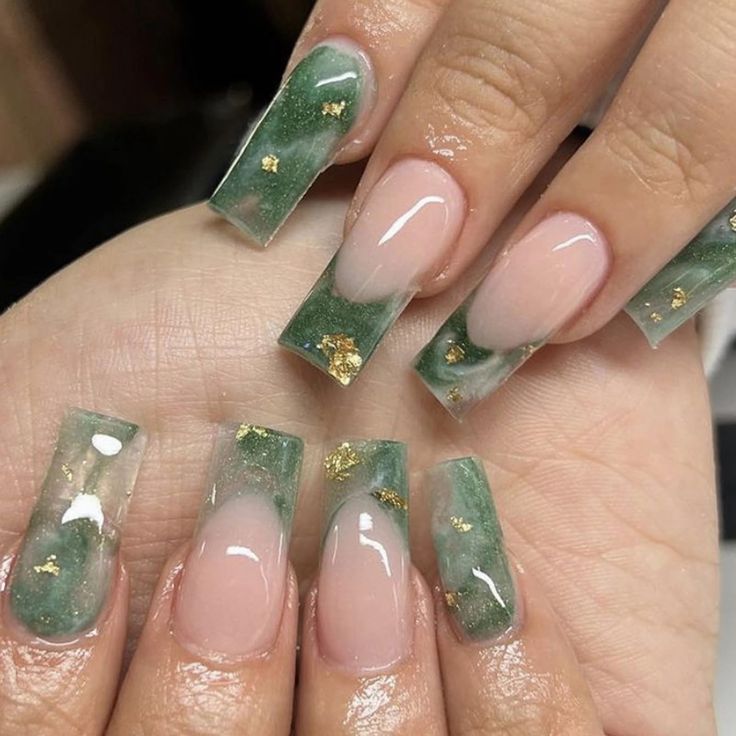 Sophisticated Nail Design with Translucent Green and Nude Tones Enhanced by Delicate Gold Flakes