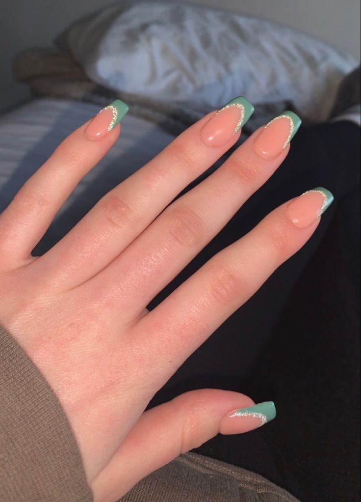 Spring-Inspired Elegant Nail Design: Soft Peach Base with Mint Green Tips and Subtle Shimmer.