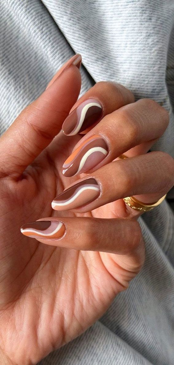 Sophisticated Nail Design with Warm Browns and White Accents