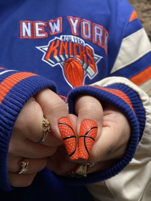 Vibrant Basketball-Inspired Nail Design for Sports Fans