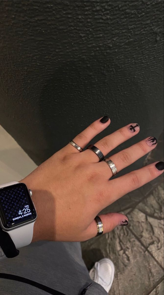 Edgy Chic: Minimalist Black Nail Design with Striking Silver Accents