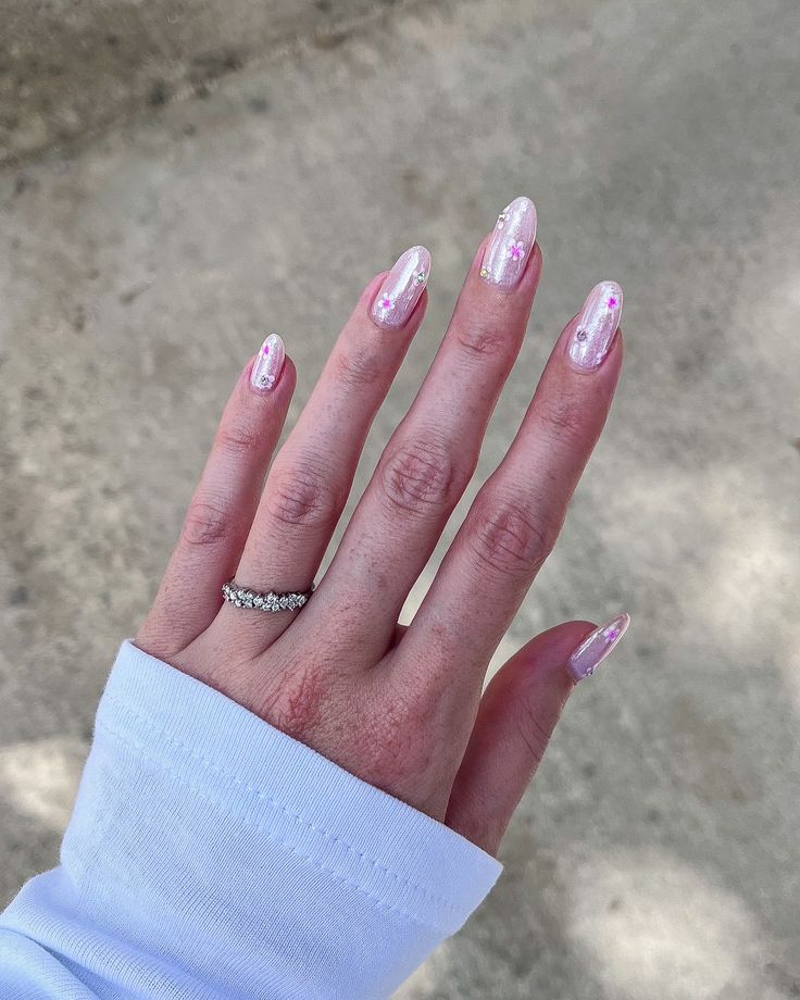 Sophisticated Soft Pink Nail Design with Glitter Accents and Stylish Shape