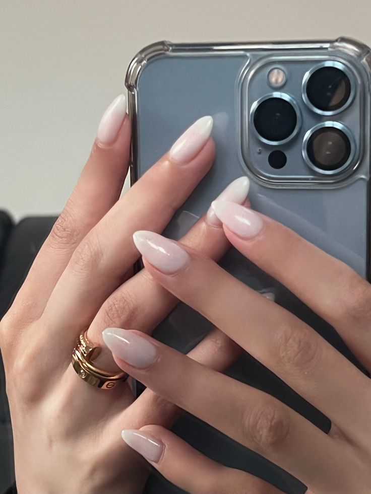 Modern Ombre Almond Nails with Delicate Gold Accents for Versatile Elegance.