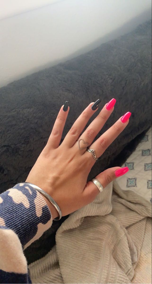 Chic Bold Nail Design: Glossy Black Meets Vibrant Pink with Modern Accents.