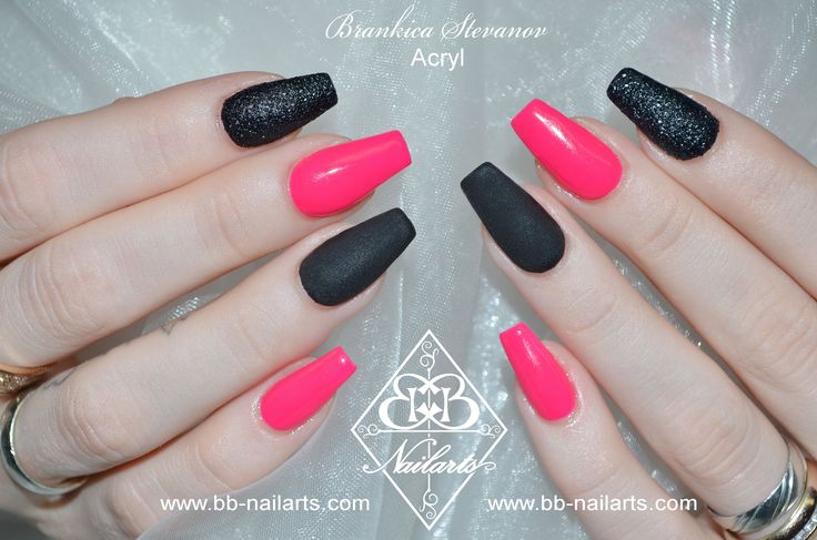 Bold Hot Pink and Matte Black Nail Design with Unique Shapes for a Stylish Statement.